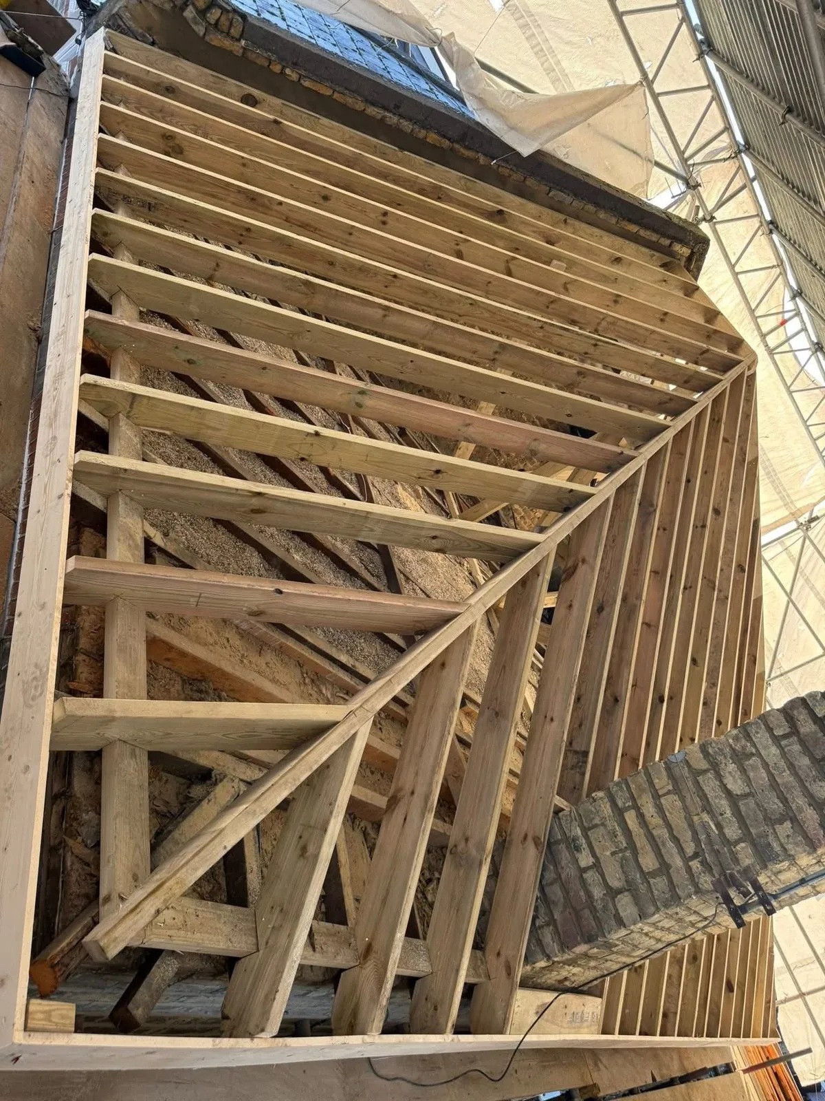 New roof timbers and rafters during a re-roof in Carn Brea